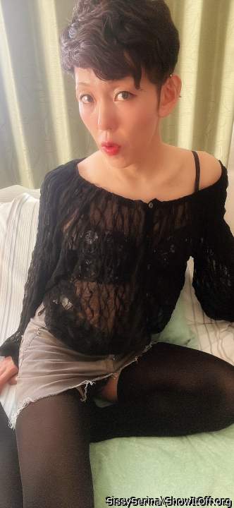 Serina is wearing a girly lace top and denim skirt