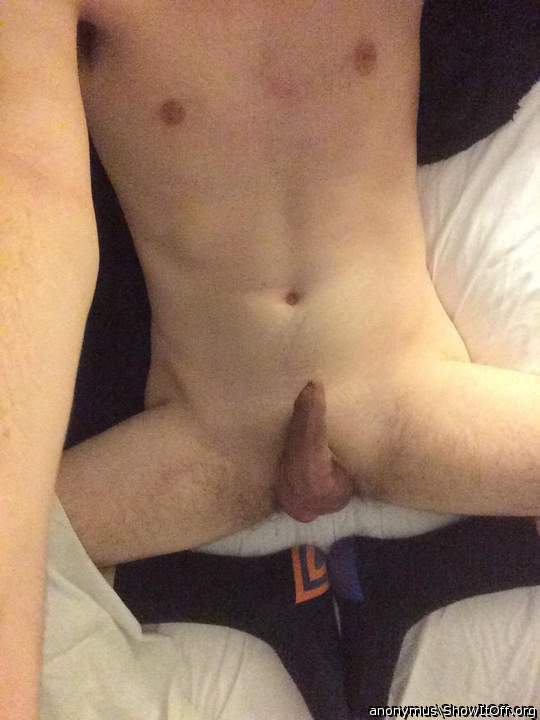 Lying on the bed naked wearing nothing but socks!