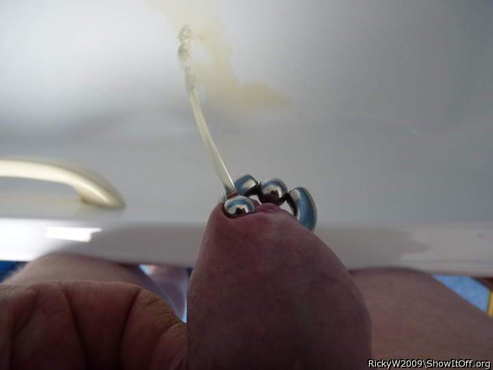 Urethra plug through foreskin piercing