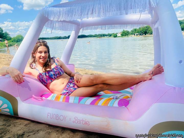 In multicolor bikini on my Barbie float at the lake!