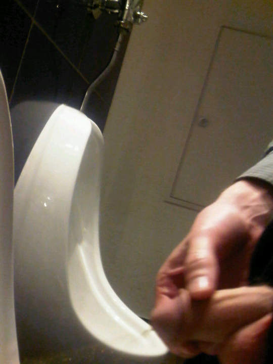 pissing at urinal