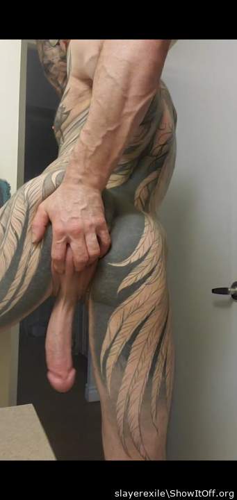 Magnificent inked body and cock!      