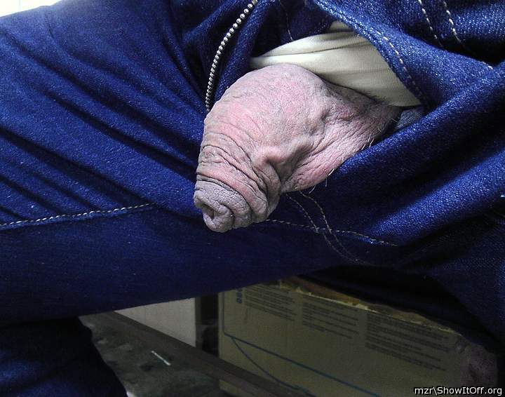 From my trousers peeps out my uncircumcised dick, covered with tender, thick, fl