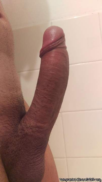 Erect and with my foreskin pulled back