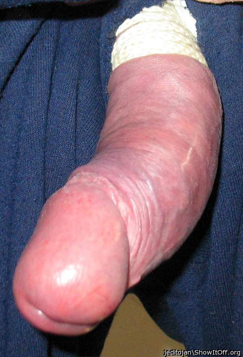 Cock tied and hanging out