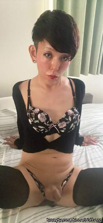 Sissy Serina is wearing a black cardigan, tight skirt and pantyhose