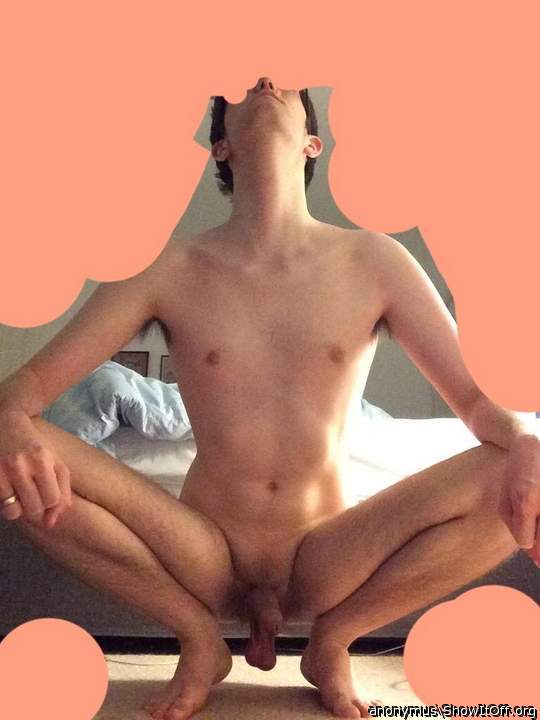 Sitting on my haunches with my hard cock and low hanging balls exposed!