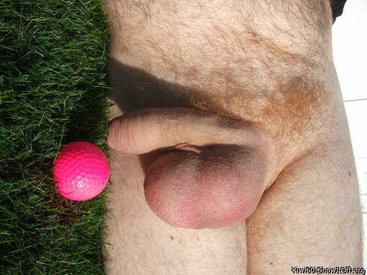 A golf ball with my balls out in the sun.