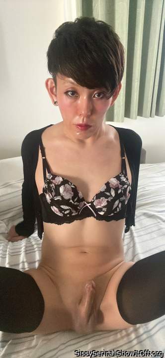 Sissy Serina is wearing a black cardigan, tight skirt and pantyhose