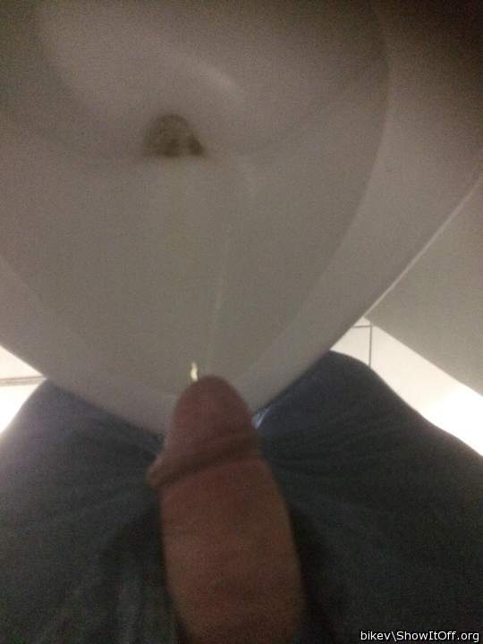 At the urinal