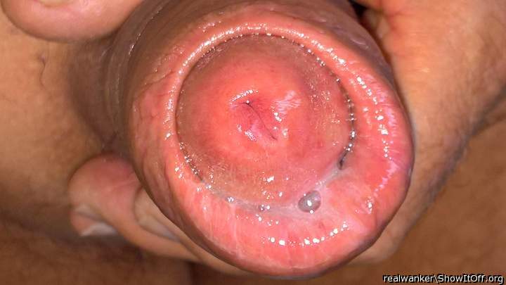 Wanna work my tongue round that juicy fat foreskin.....   