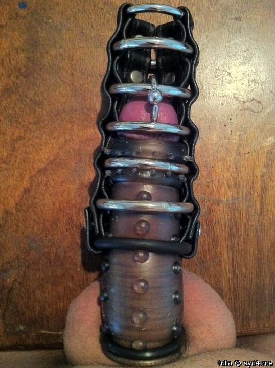 pierced knob sheathed and caged laying on the table