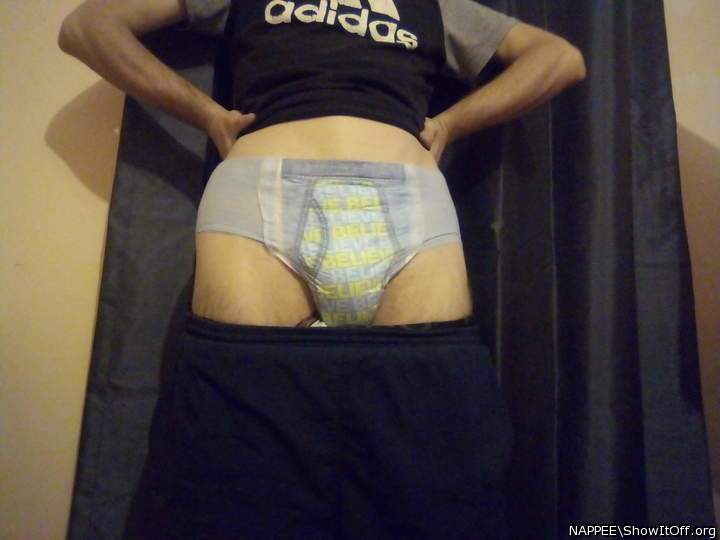 Pants pulled down to show nappy!