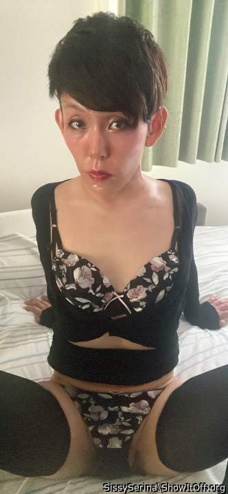 Sissy Serina is wearing a black cardigan, tight skirt and pantyhose