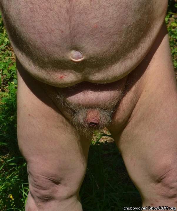 playing nude in the garden